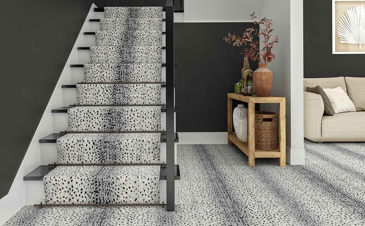 White leopard printed carpet on stairs and hallway.