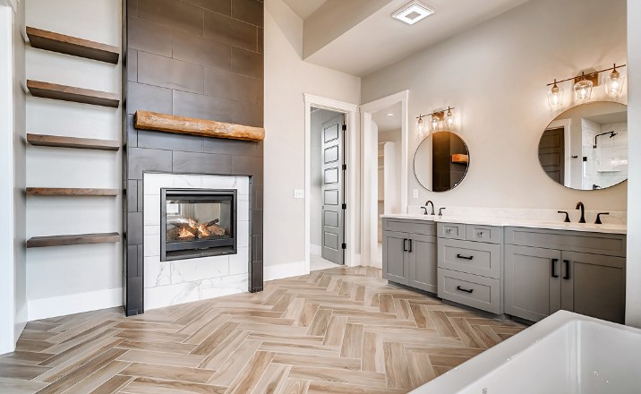 bathroom with hardwood, fireplace, two sinks
