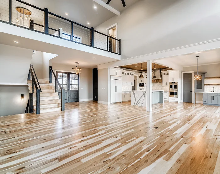 home with stairs, kitchen, bar, and vinyl flooring