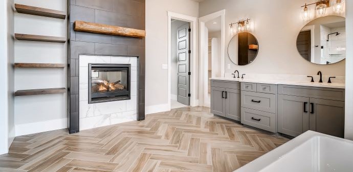 Bathroom herringbone tile with custom fireplace
